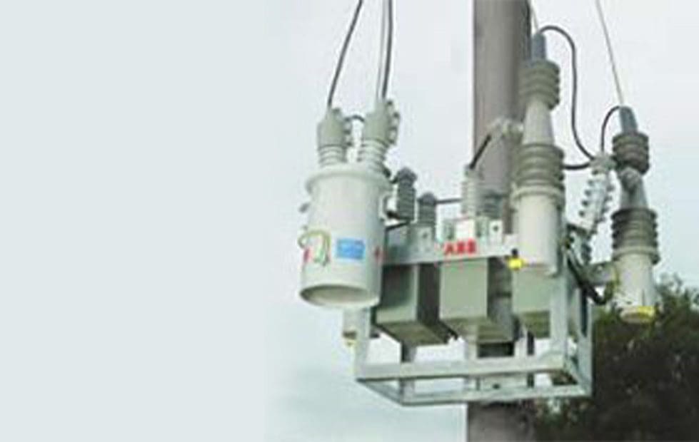 A close up of some electrical equipment on top of a pole
